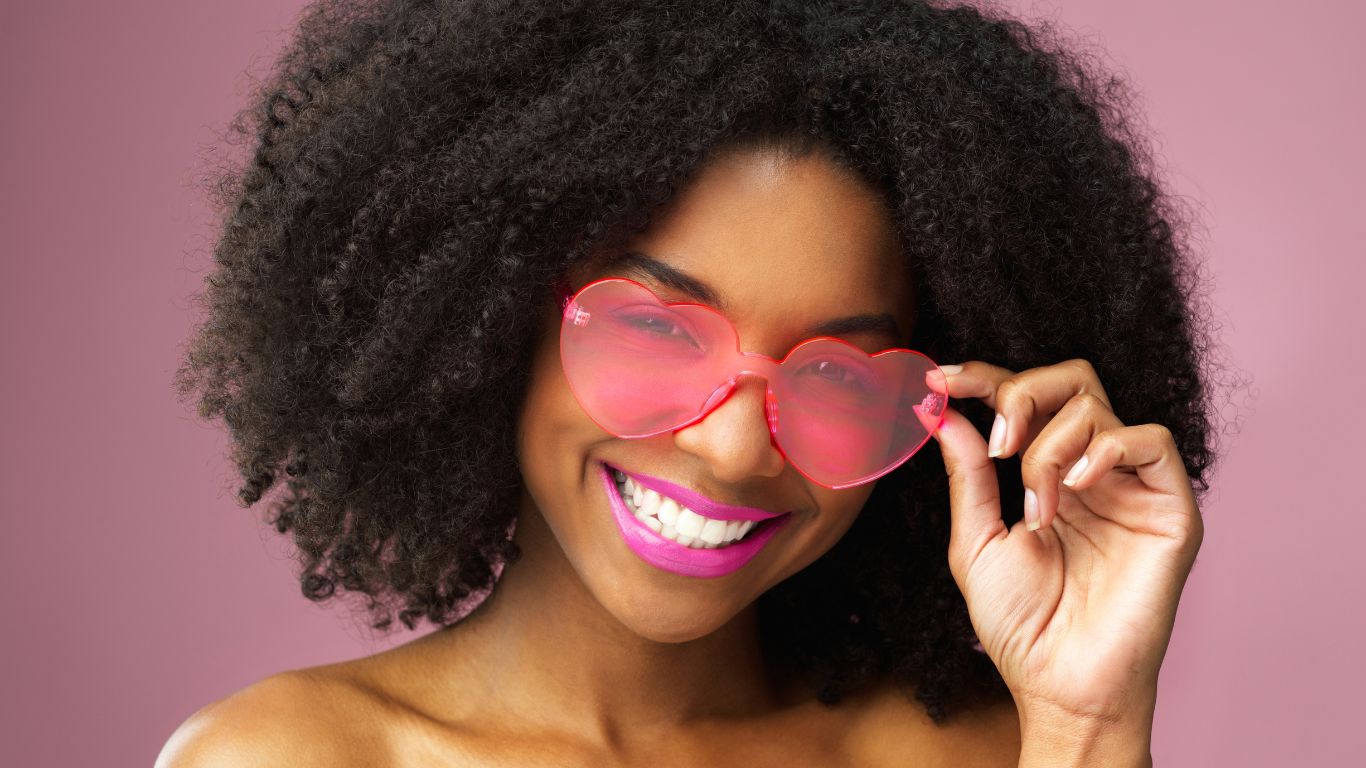 a black woman wearing Rose Coloured Glasses